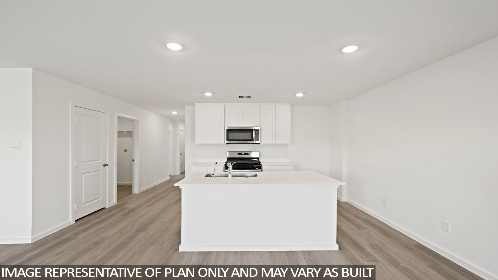 open concept living and dining area with vinyl flooring, quartz countertops, and large windows