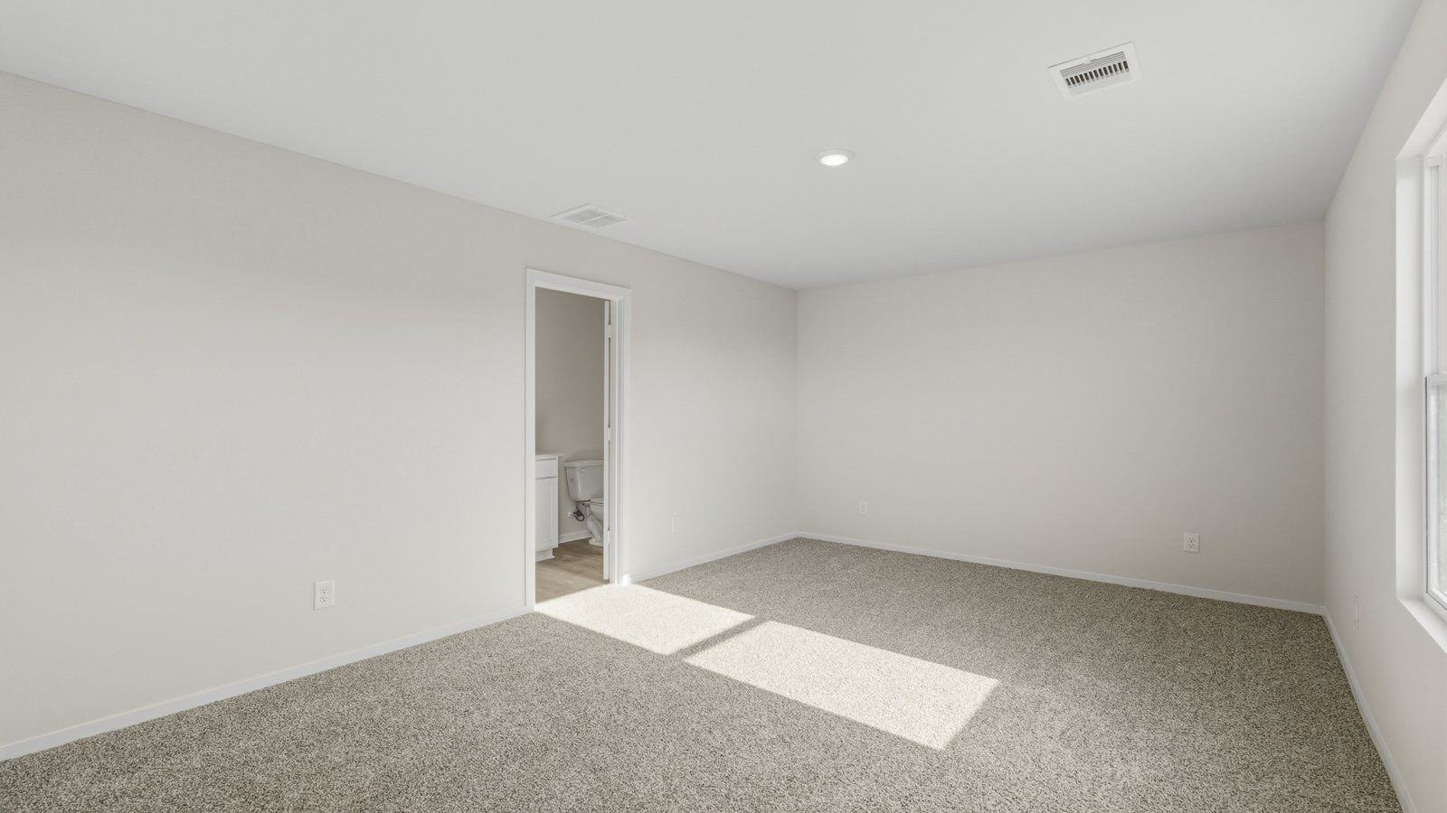 Primary bedroom walk-in closet with carpet flooring in Katy TX