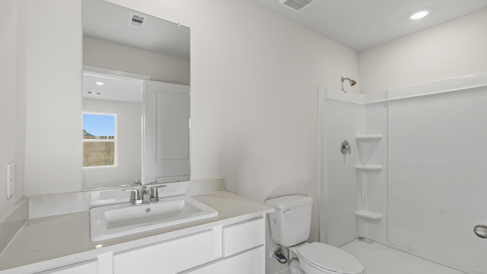 Primary bathroom with stand-alone shower with tiles and semi frameless glass in Katy TX