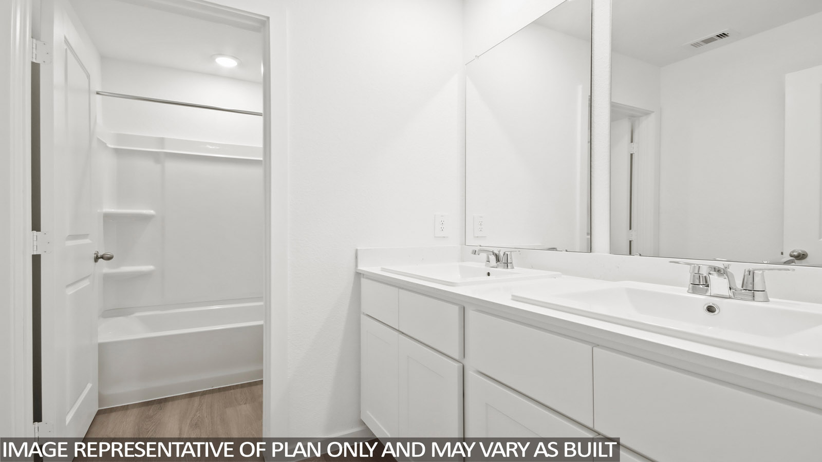 primary bathroom with dual vanity sinks