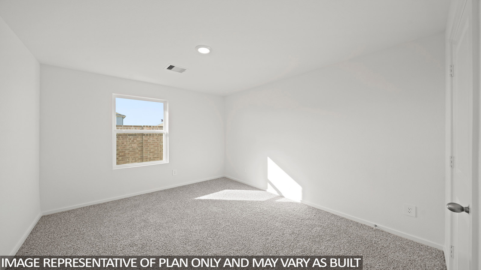 Primary bedroom with carpet flooring