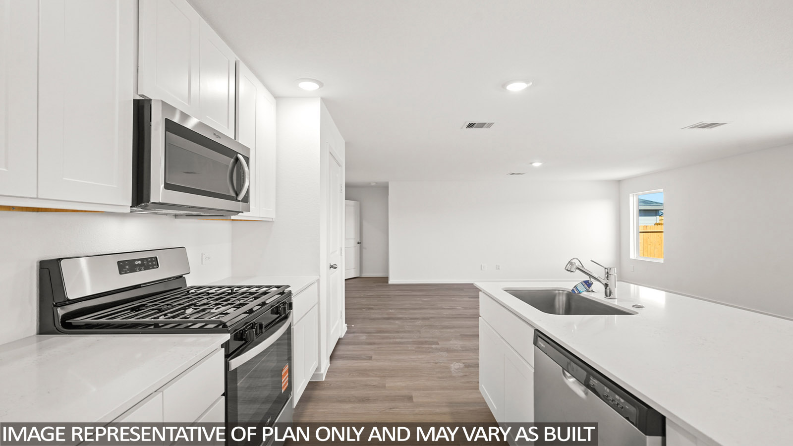 open concept livving and dining area with vinyl flooring, quartz countertops, and large windows