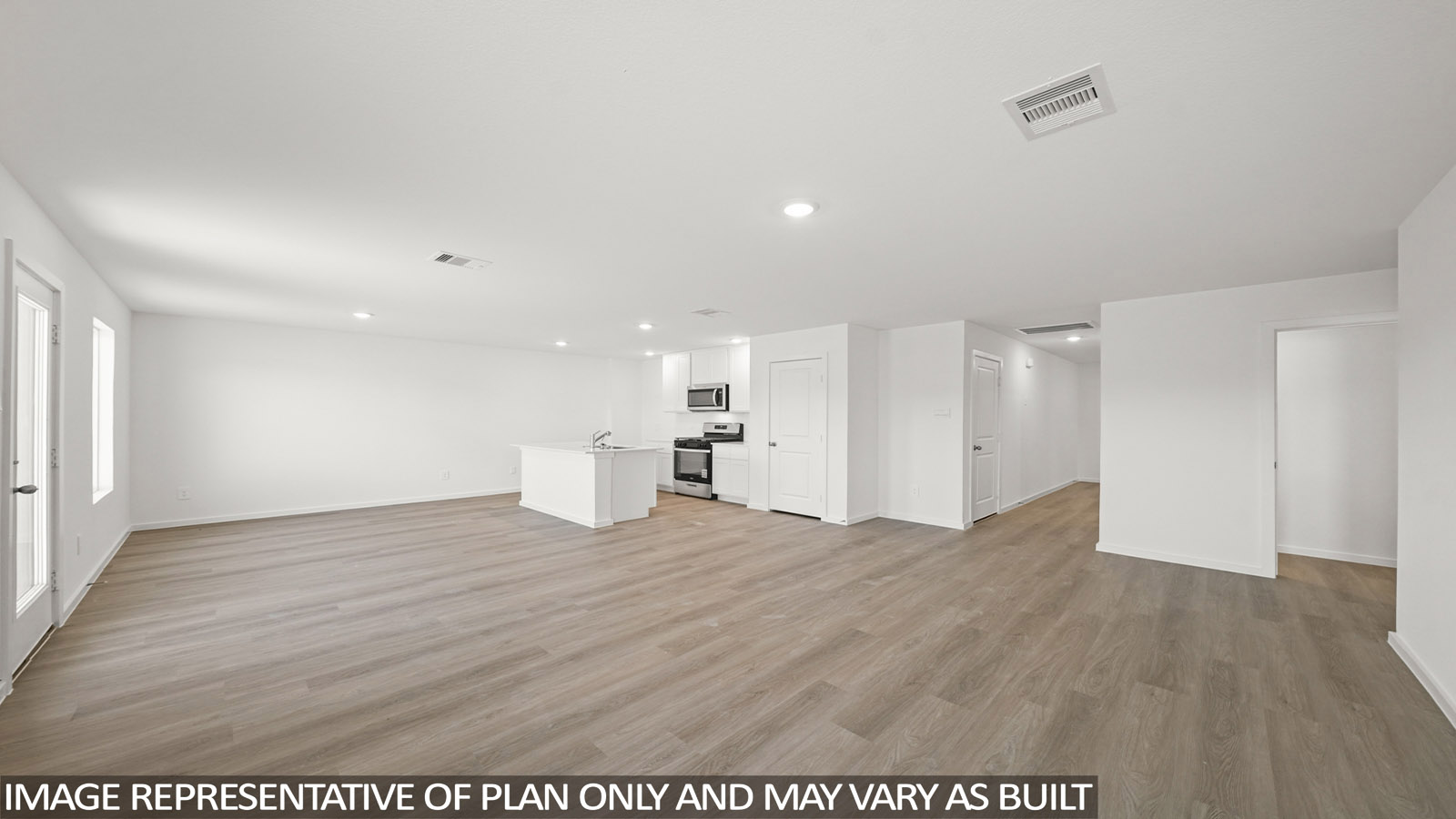 open concept livving and dining area with vinyl flooring, quartz countertops, and large windows