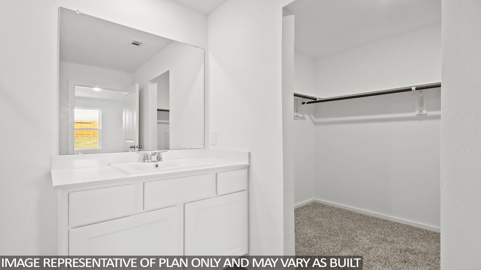 primary bathroom with dual vanity sink