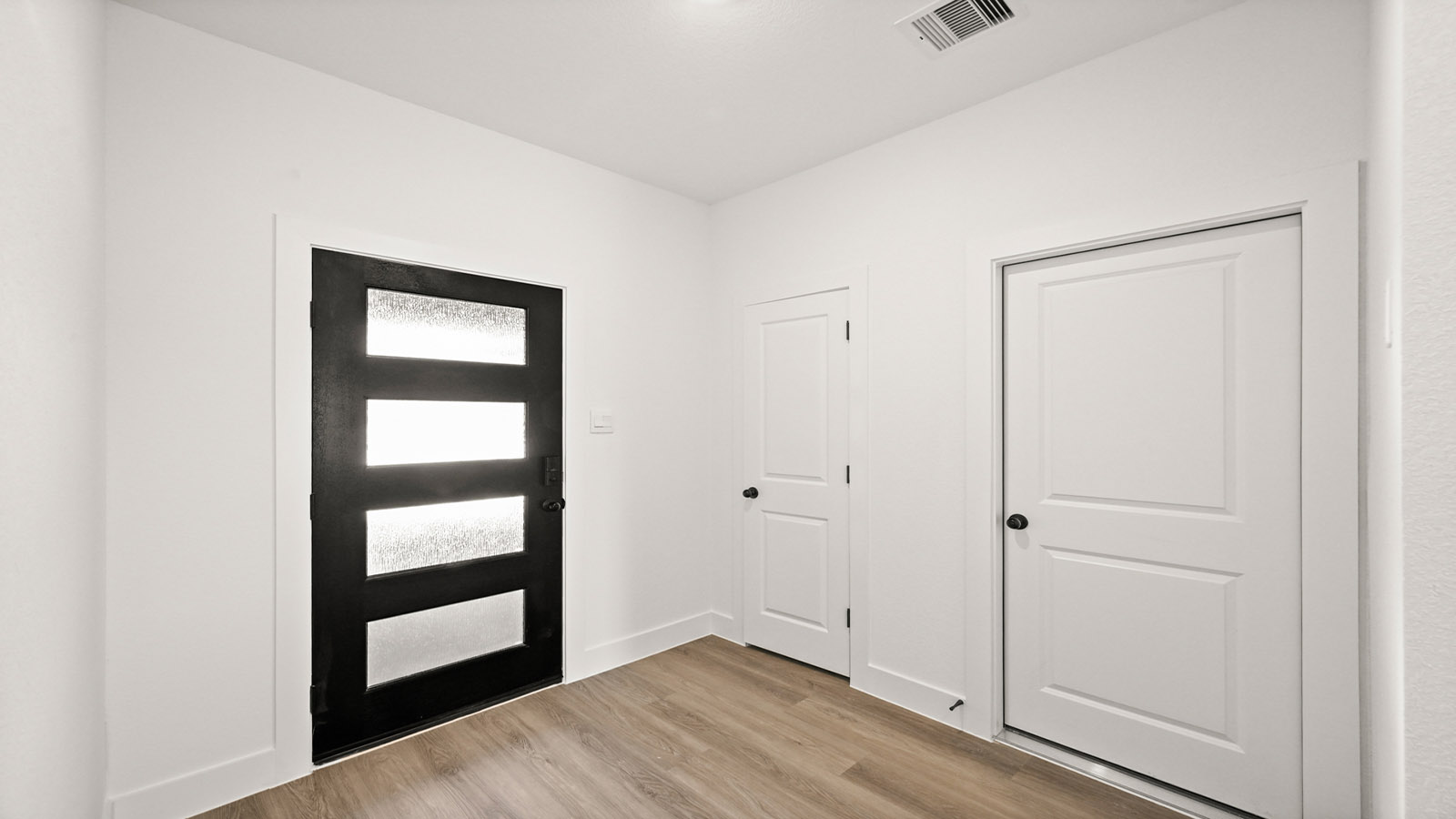Entry hallway with vinyl flooring