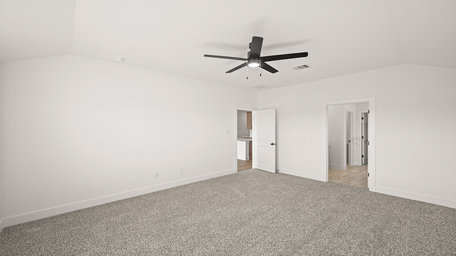 Primary bedroom with carpet flooring