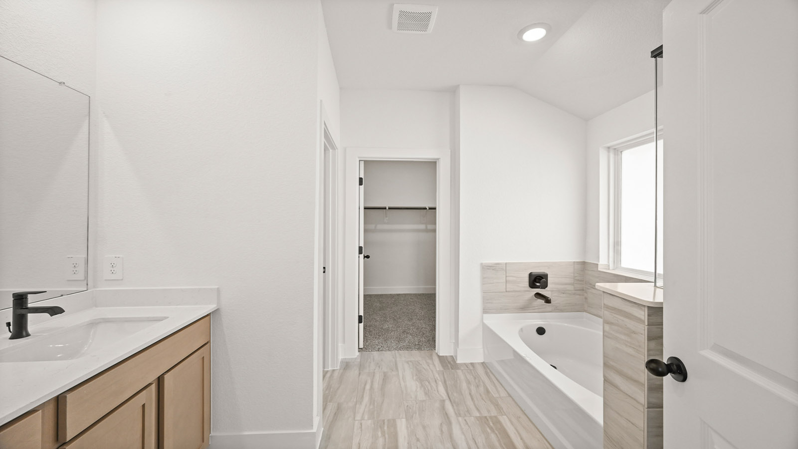 Primary bathroom with tub and shower