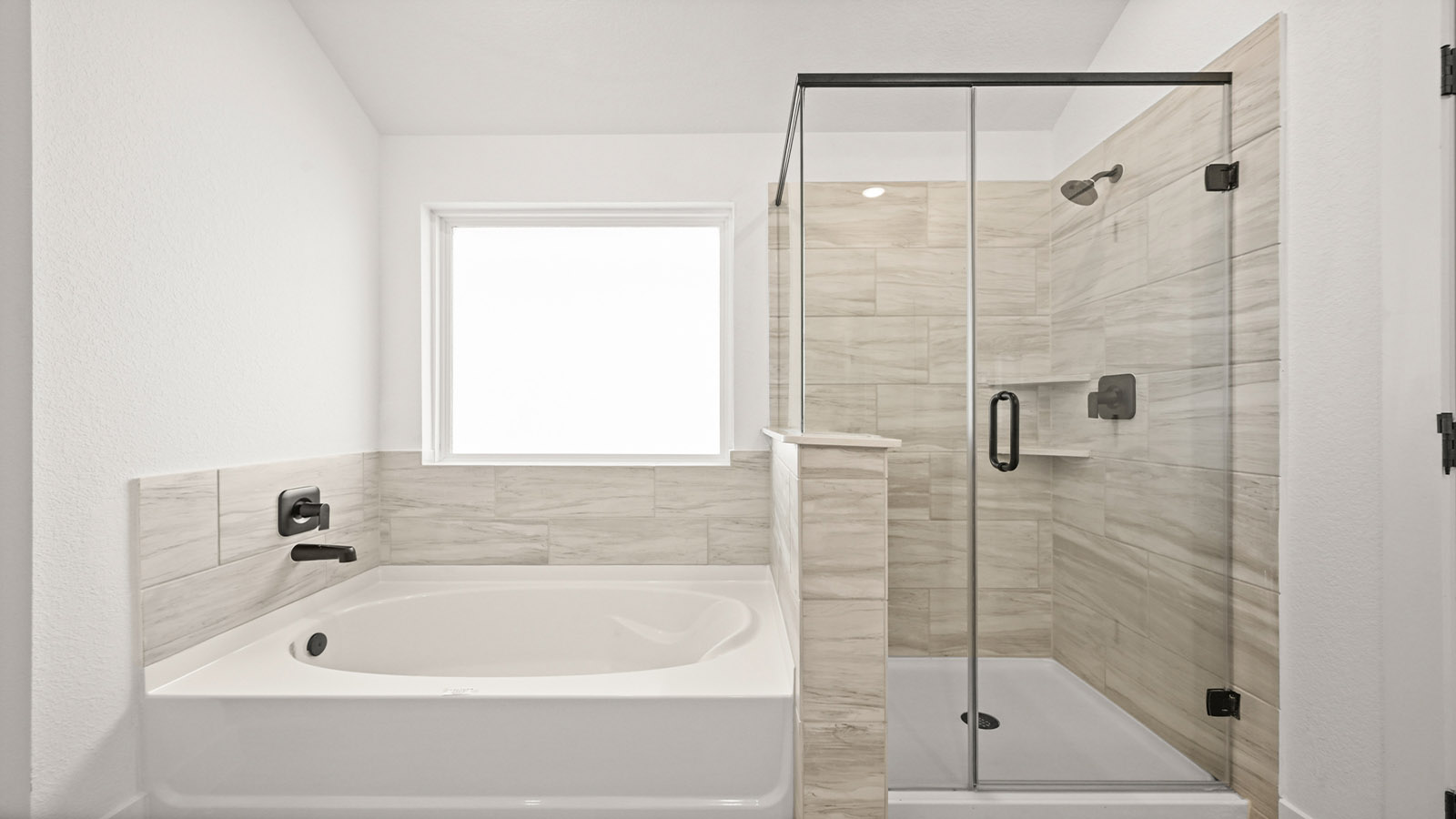 Primary bathroom with tub and shower