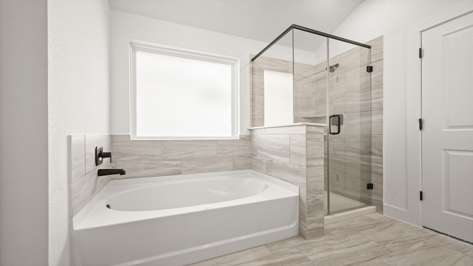 Primary bathroom with tub and shower