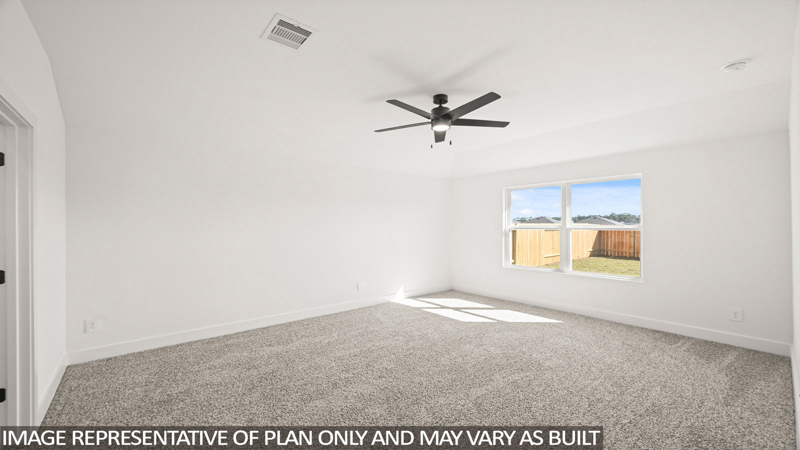 Large Primary bedroom with shag carpet flooring and bright window