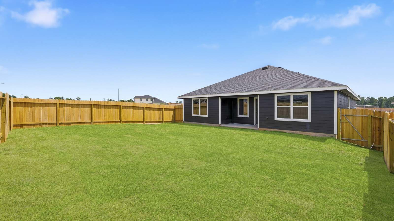 covered patio with jamies hardie siding and overhead lighting