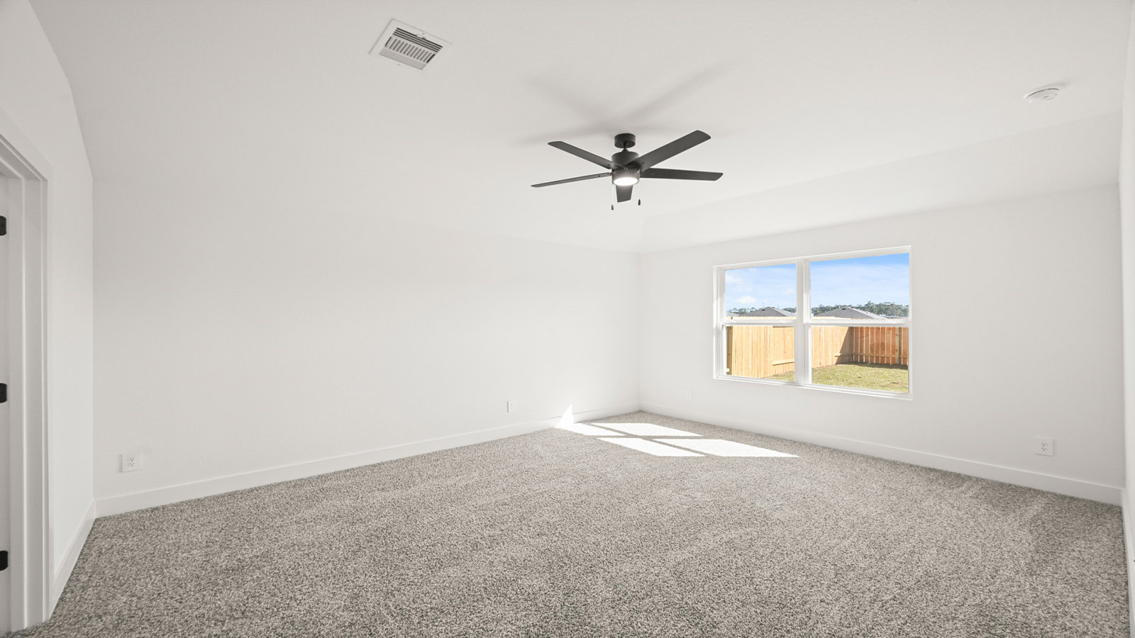 Primary bedroom with carpet flooringPrimary bedroom with carpet flooring
