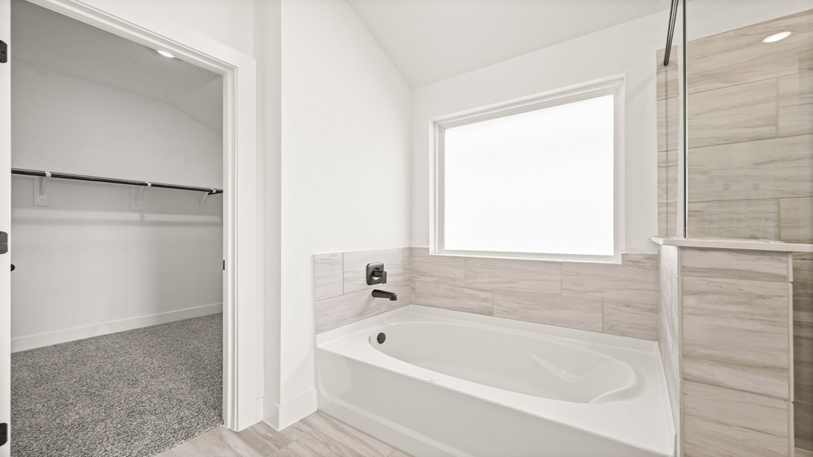 Primary bathroom with tub and shower