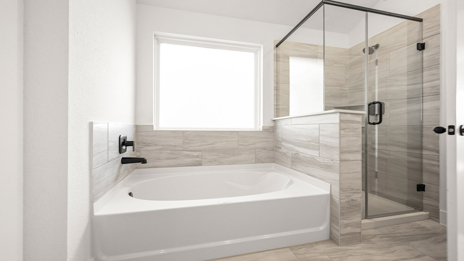 Primary bathroom with tub and shower