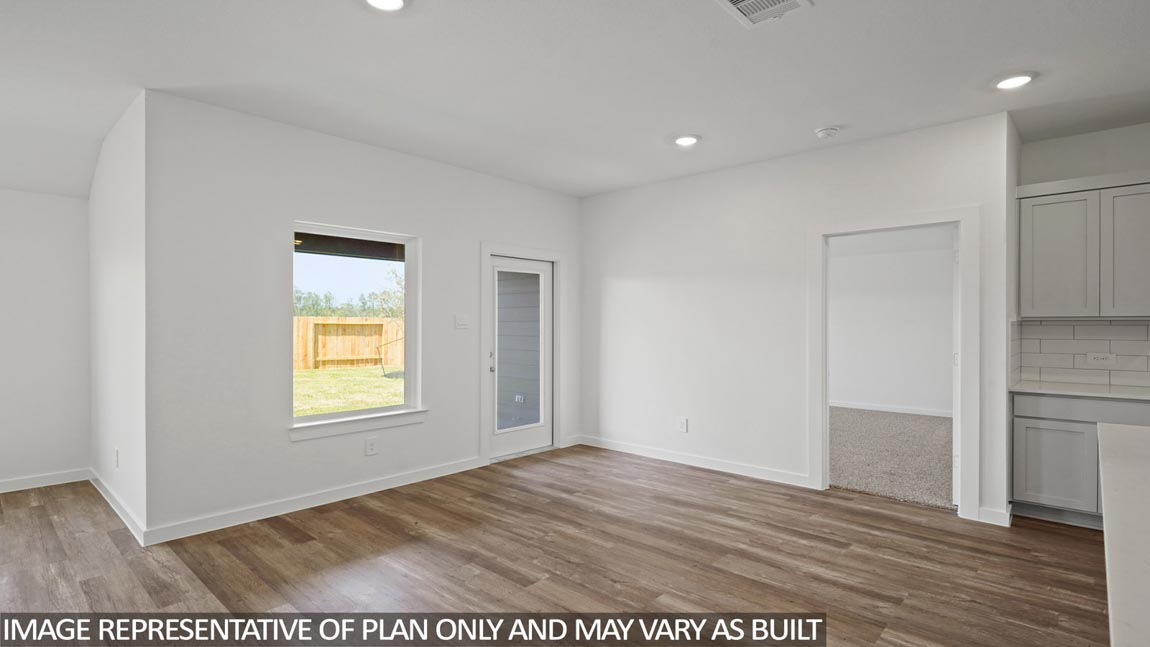 open concept living and dining areas with vinyl flooring and large windows