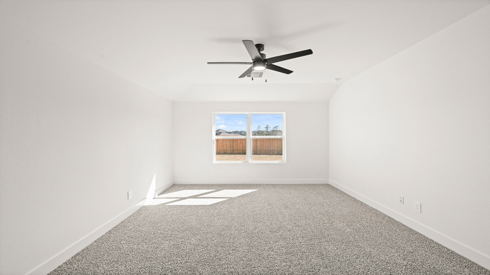 Primary bedroom with bright windows