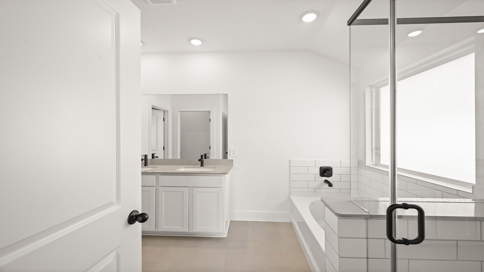 Primary bathroom with tub and shower