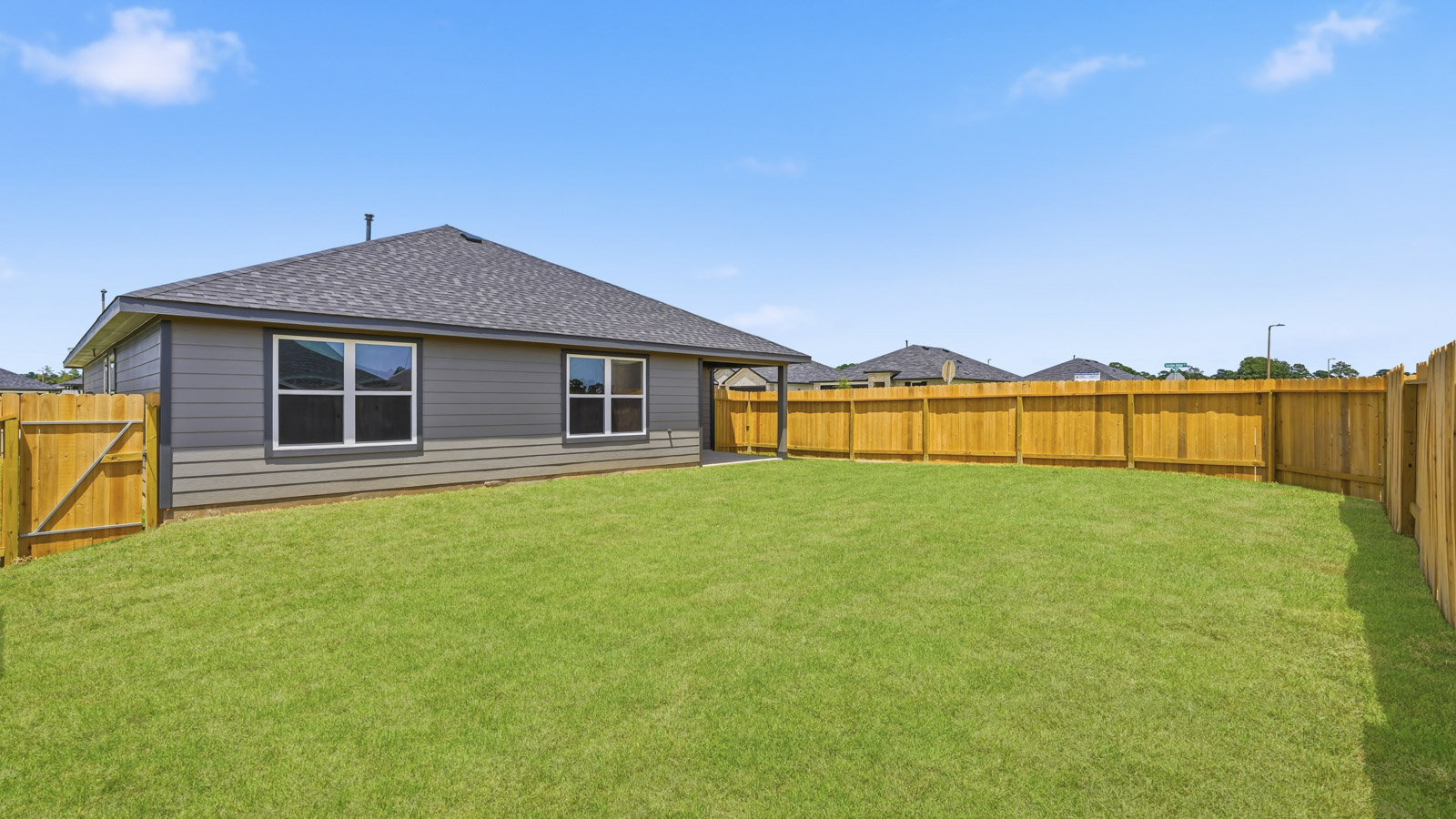 back of house with james hardie siding and glass back door