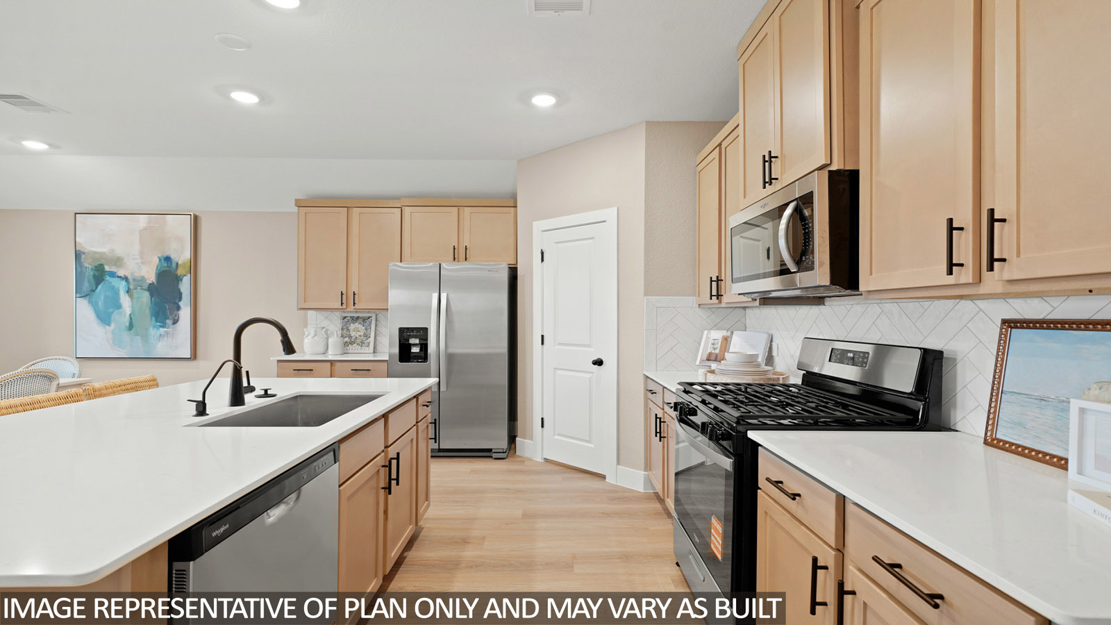 Kitchen with an island and vinyl floor