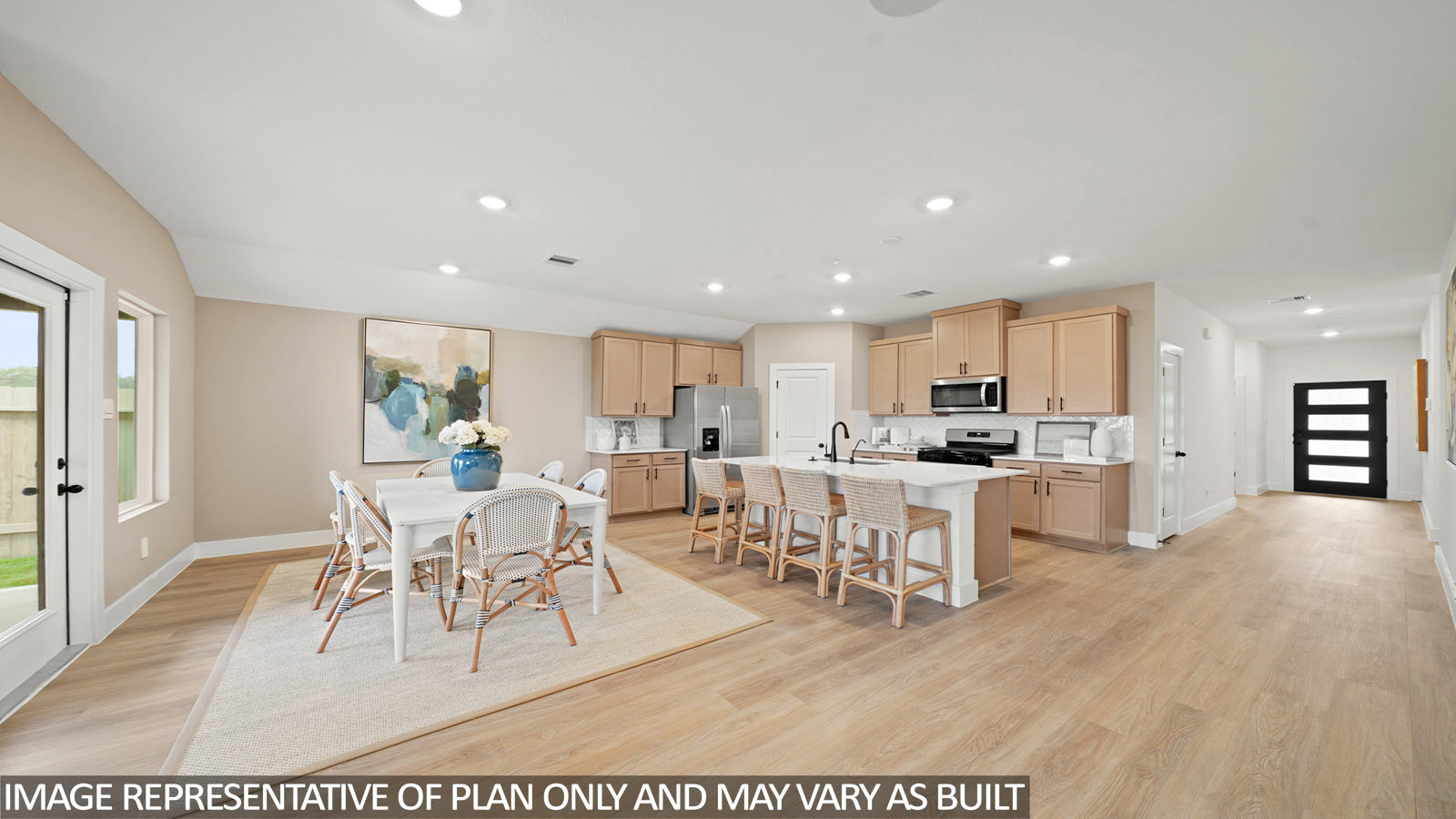 Kitchen with an island and vinyl floor