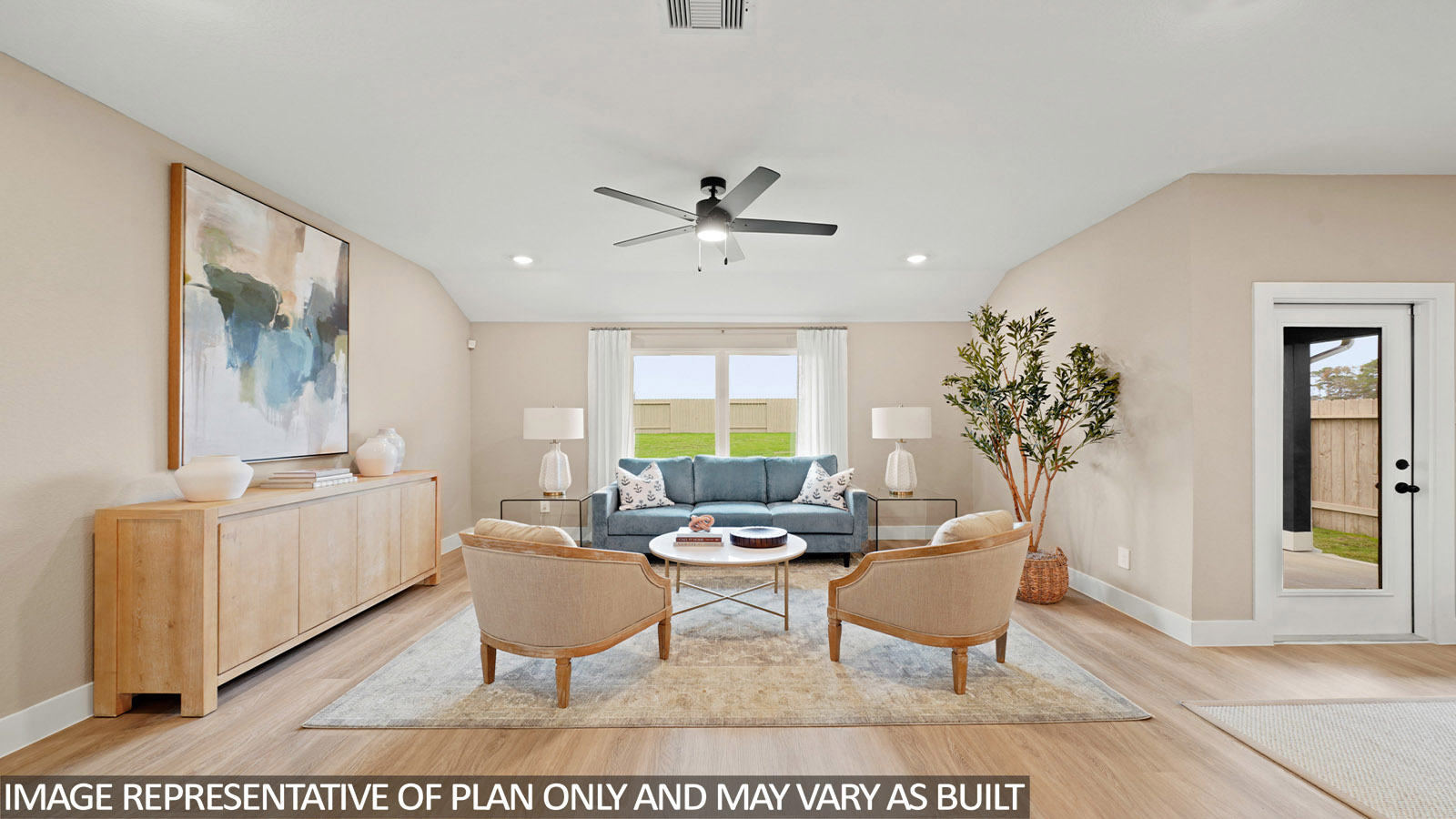 Spacious living area with vinyl flooring