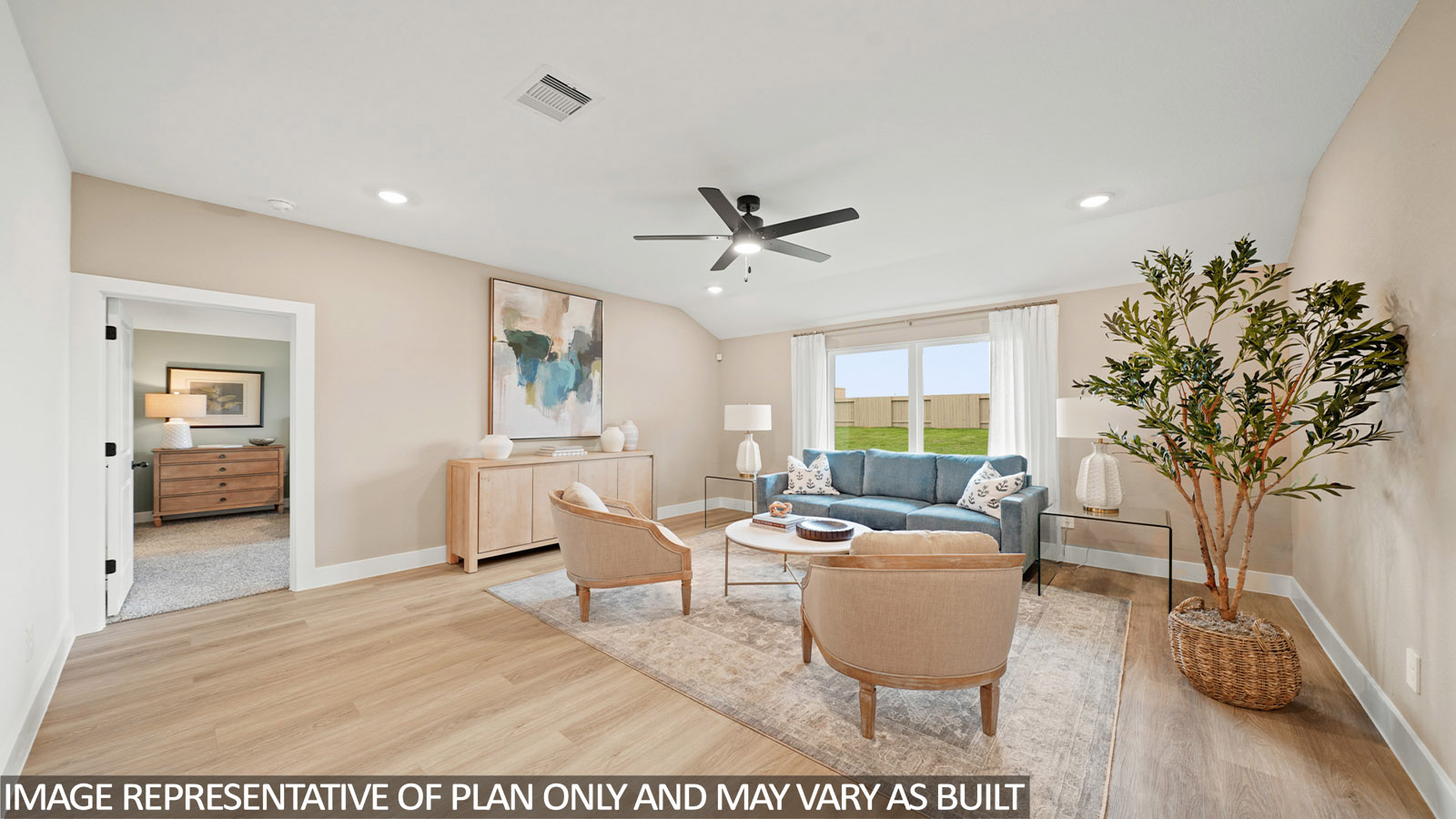 Spacious living area with vinyl flooring