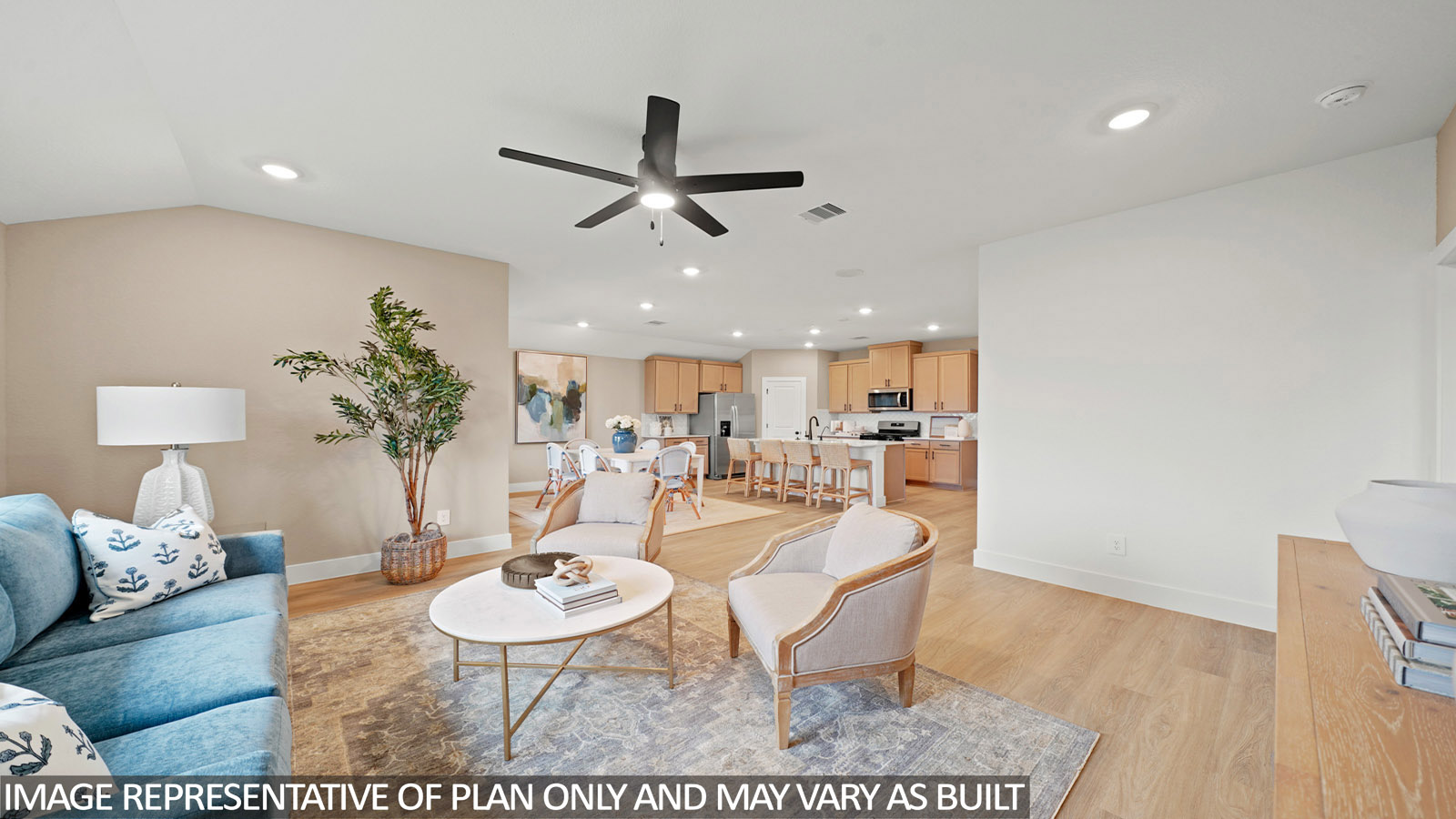 Spacious living area with vinyl flooring
