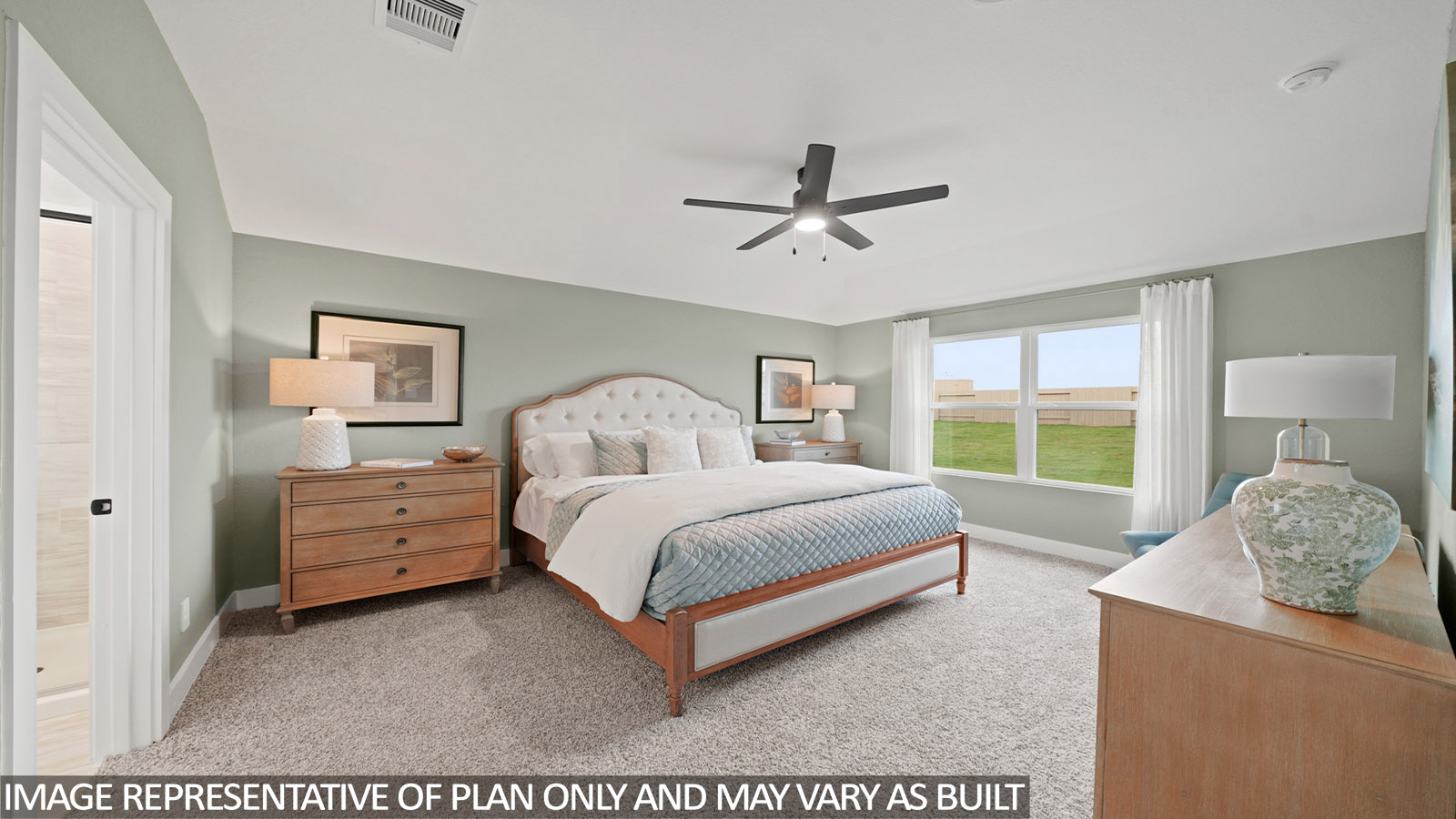 Primary bedroom with carpet flooring