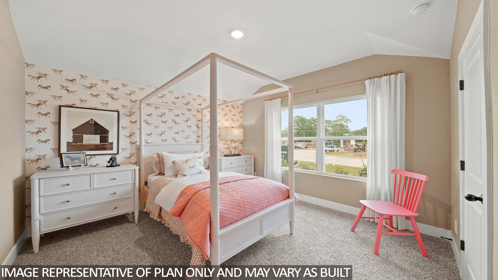 Secondary bedroom with carpet flooring