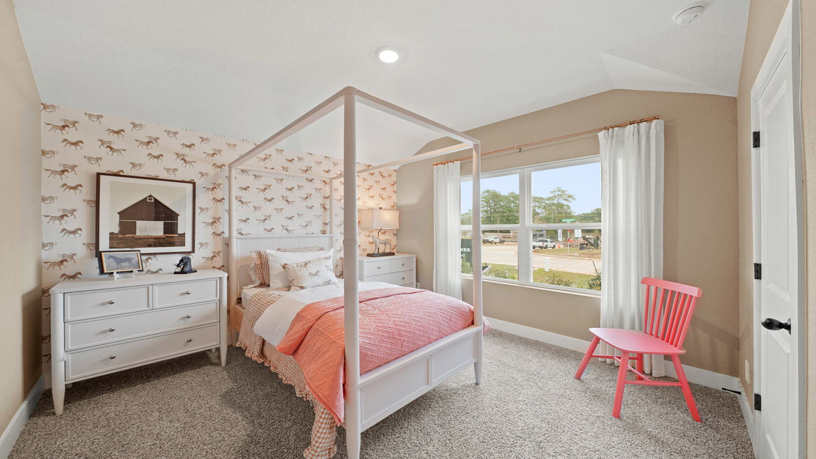 Secondary bedroom with carpet flooring
