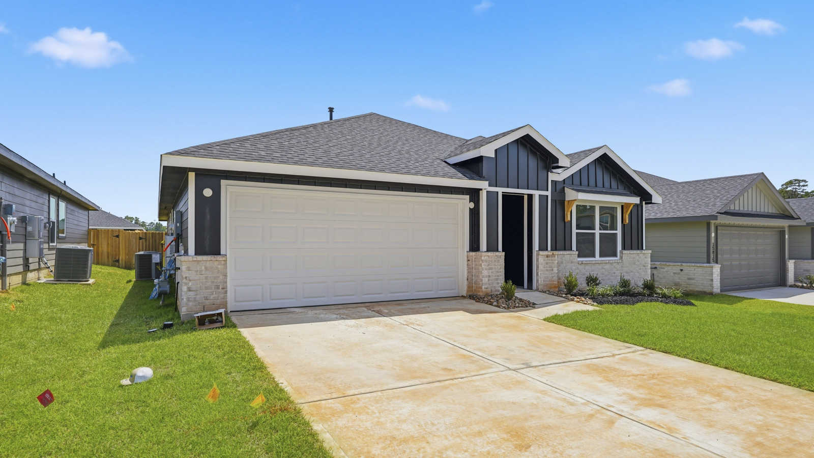 covered patio with jamies hardie siding and overhead lighting