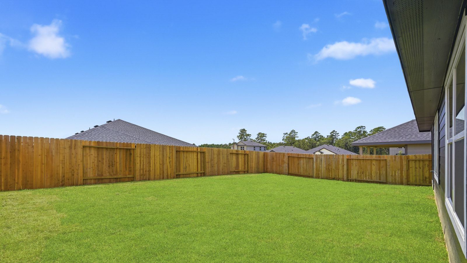 covered patio with jamies hardie siding and overhead lighting
