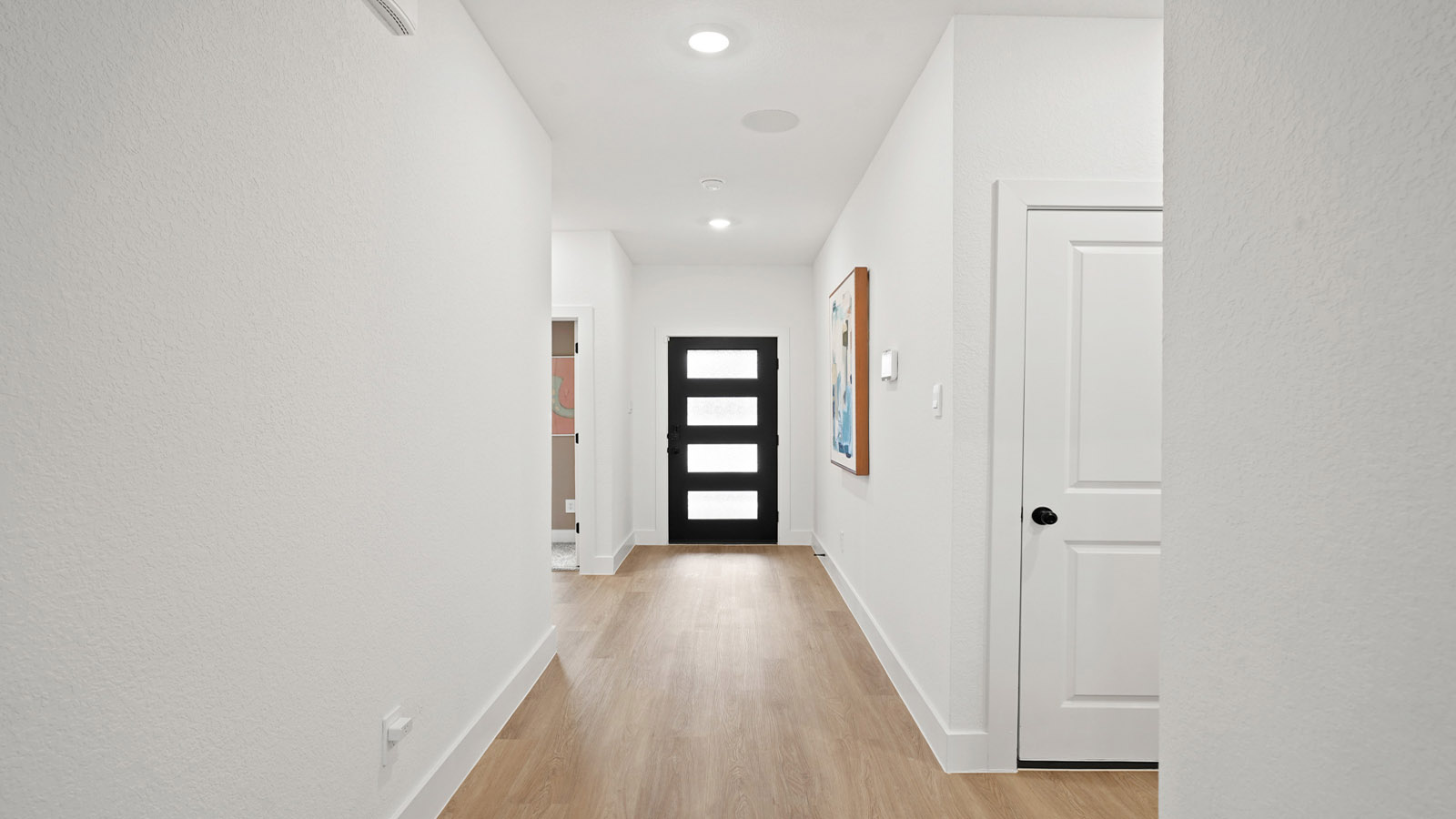Entry hallway with vinyl flooring