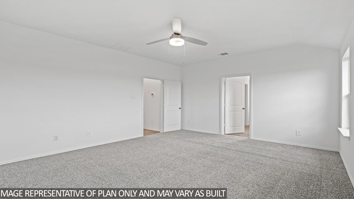 Primary bedroom with carpet flooring