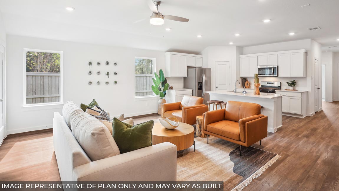 open concept living and dining room with vinyl flooring and large windows
