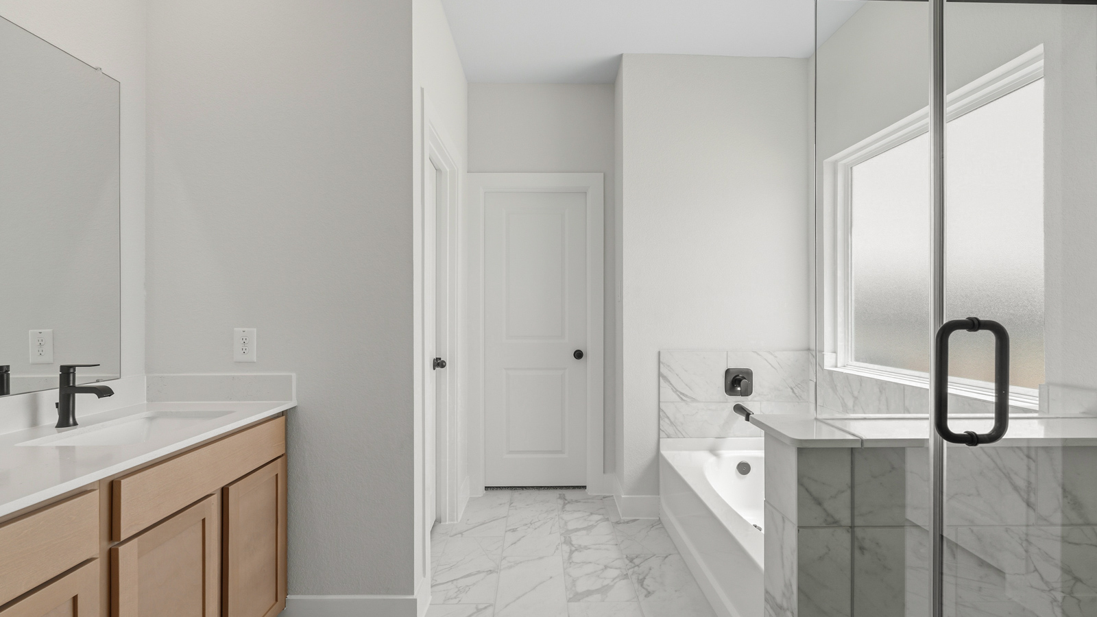 Primary bathroom with double sinks with quartz counter tops in montgomery TX