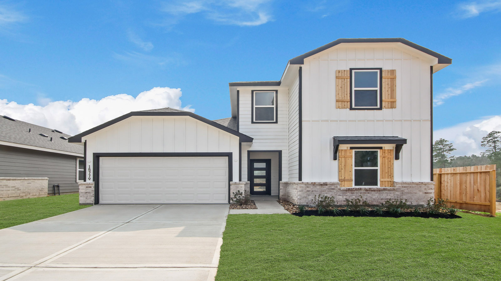 two story home with two car garage