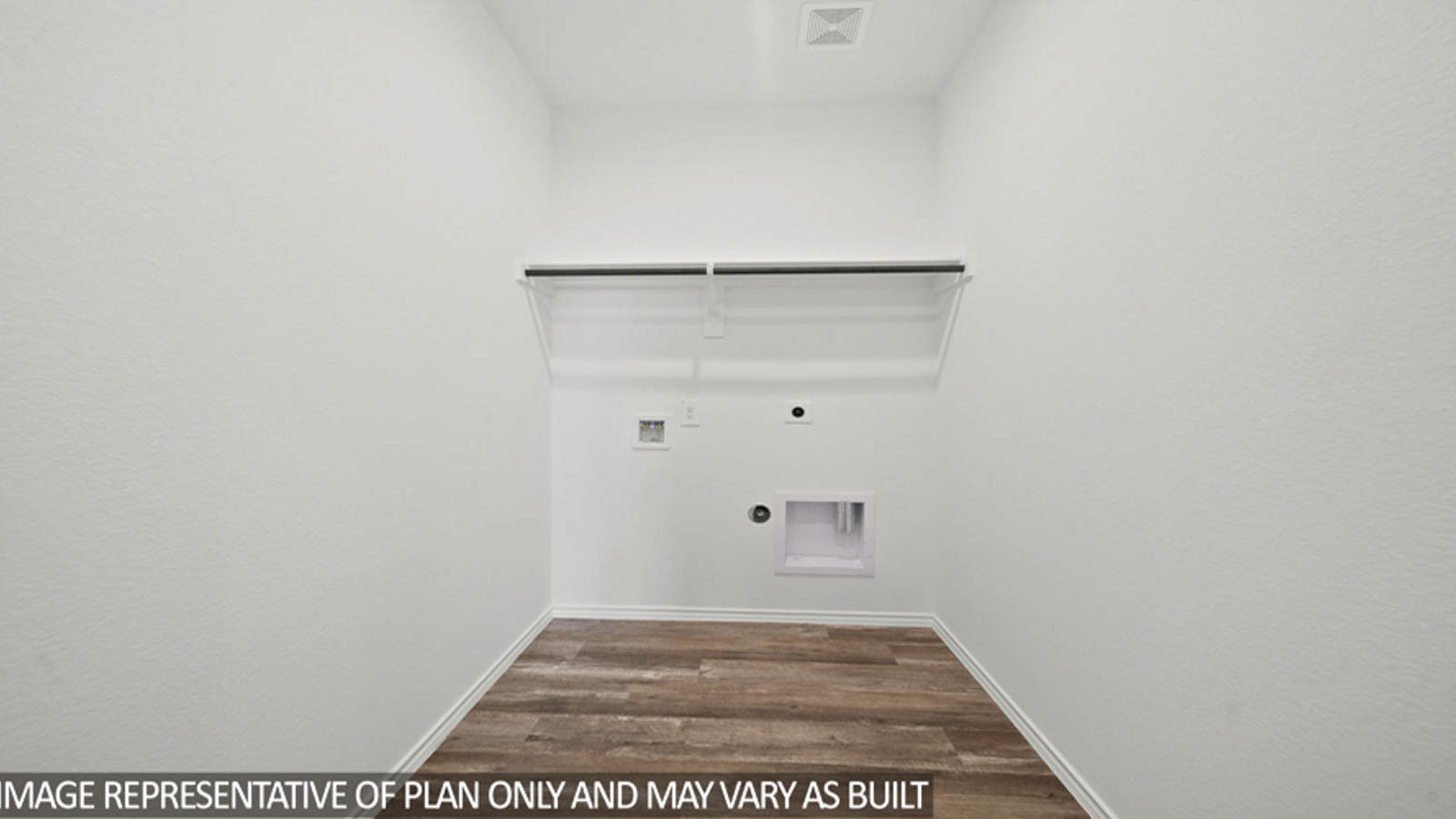 Utility room with storage located off the entry hallway and garage door