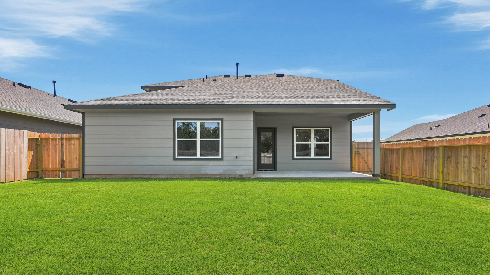 covered patio with jamies hardie siding and overhead lighting