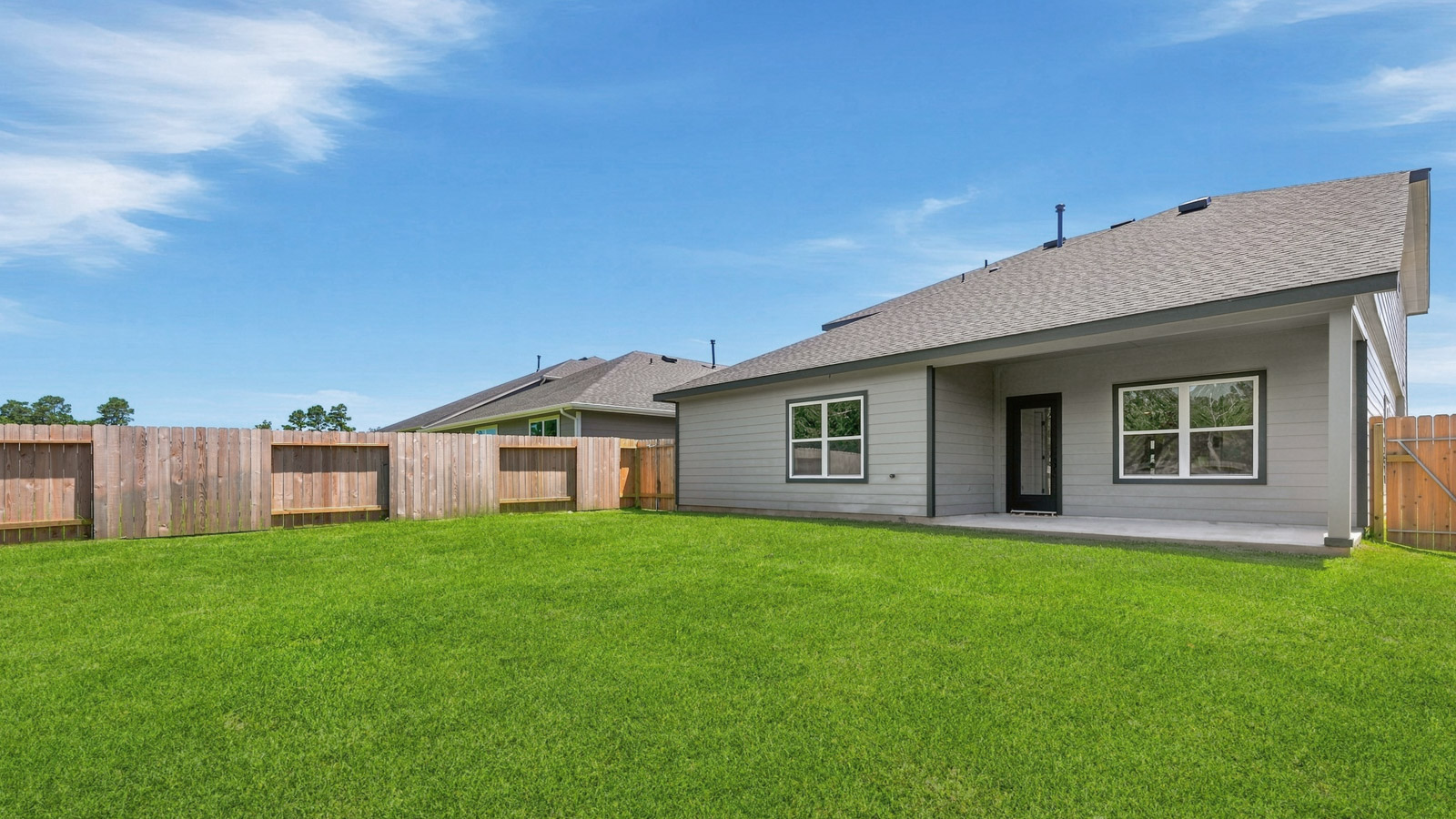 covered patio with jamies hardie siding and overhead lighting