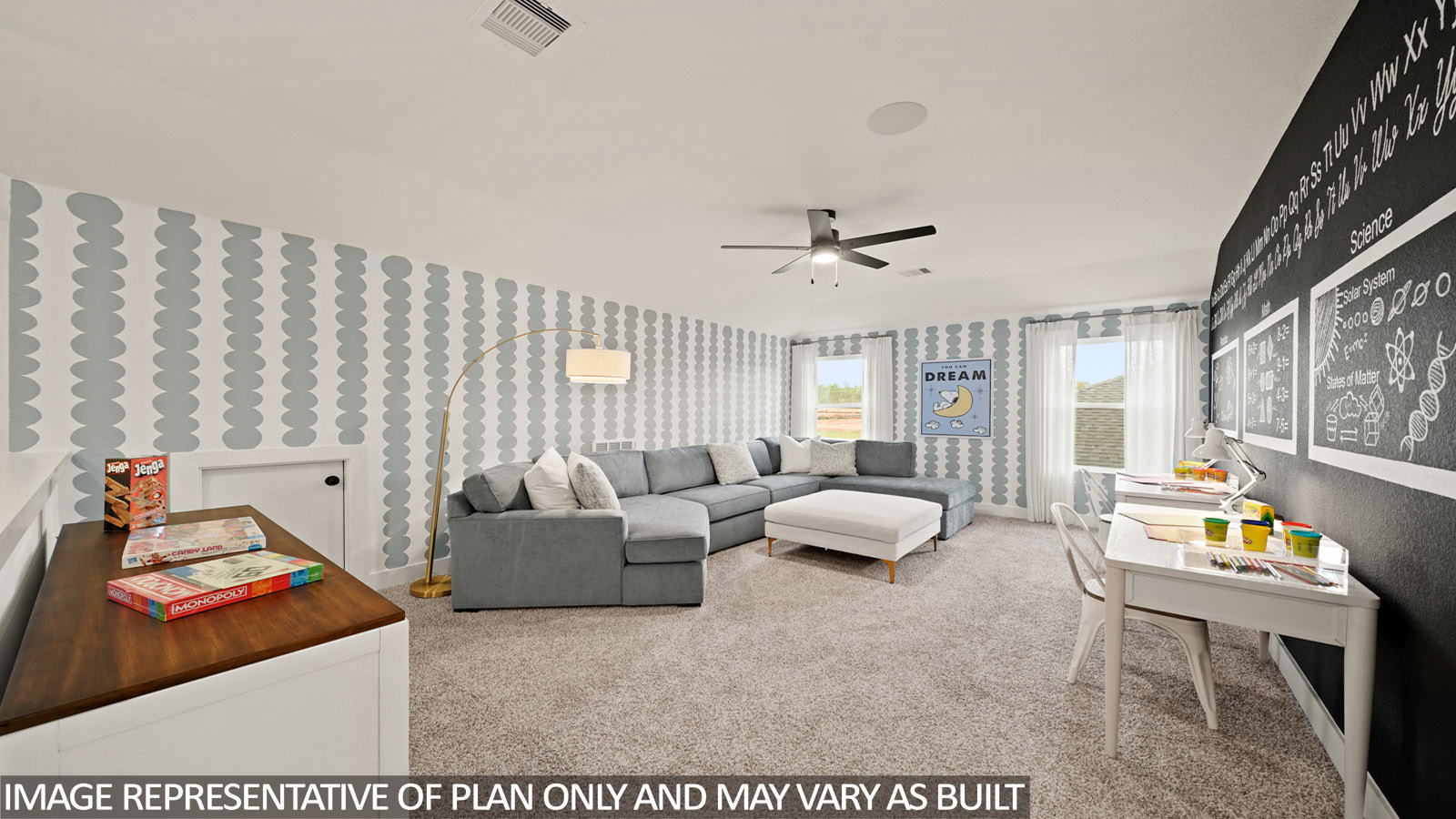 Second story game room with carpet flooring with bright windows in this multi functional space in Montgomery TX