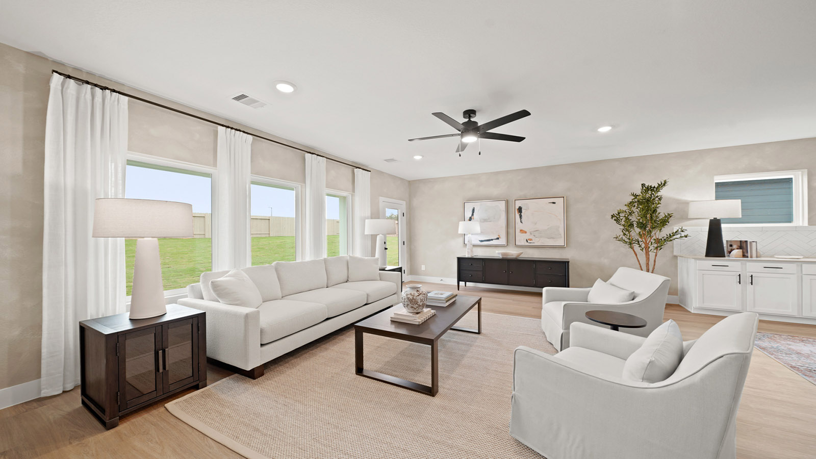Spacious living area with vinyl flooring