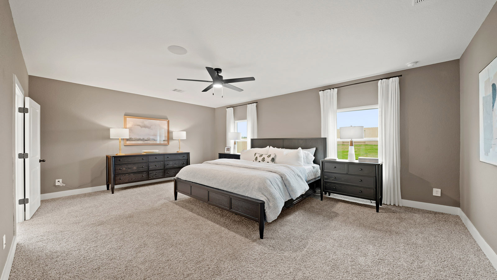 Primary bedroom with carpet flooring