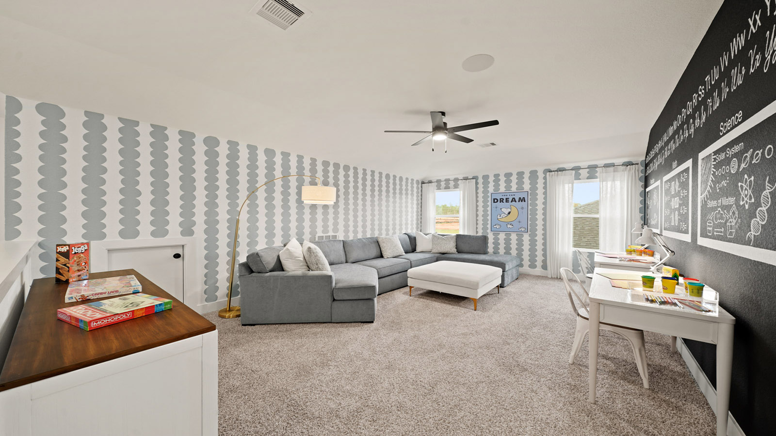 Second story game room with carpet flooring