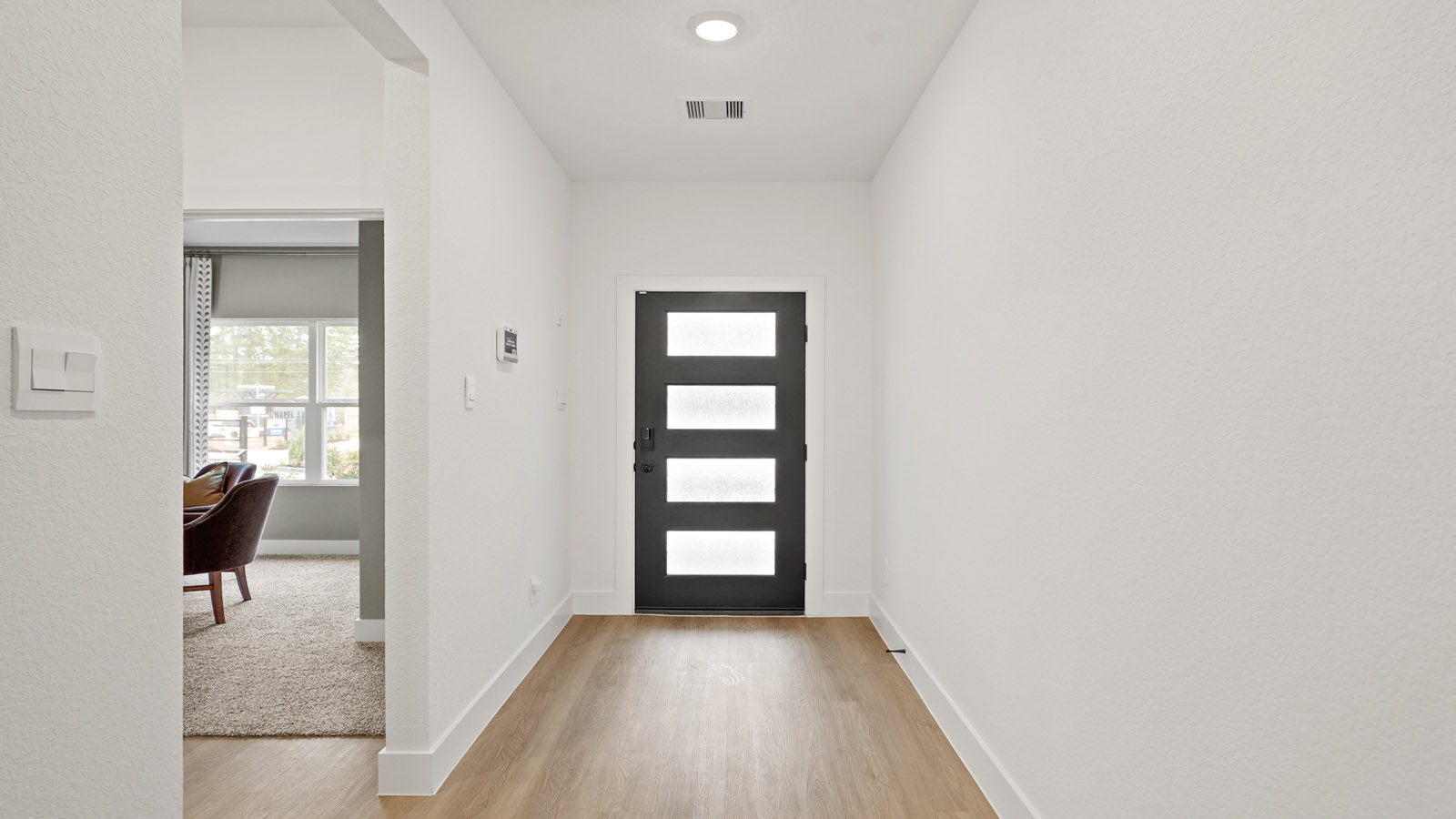 Entry hallway with vinyl flooring