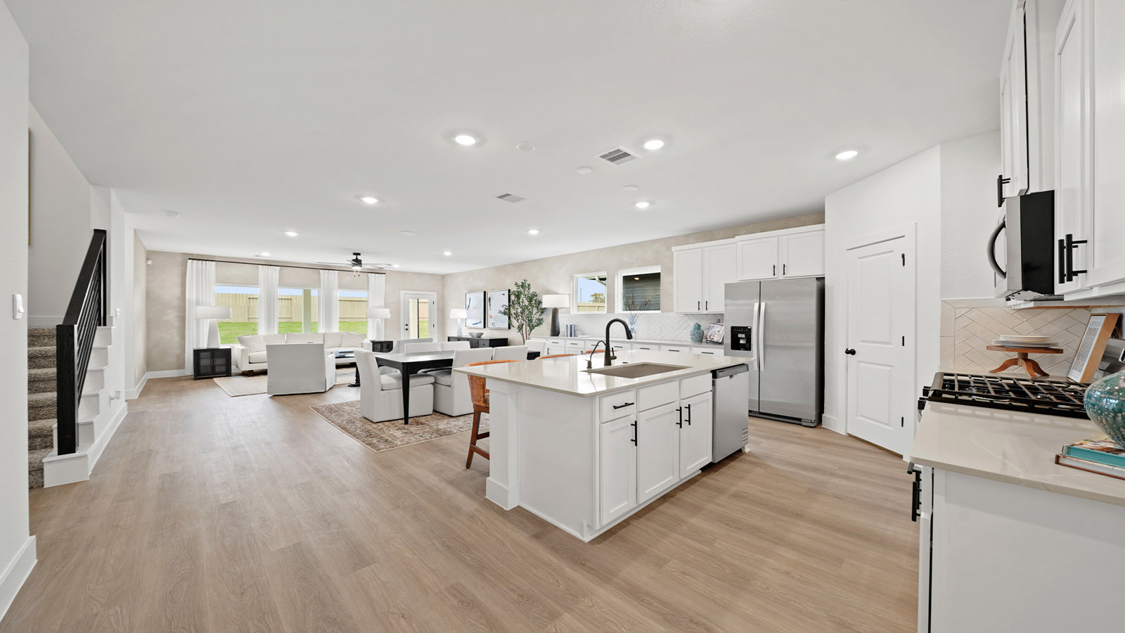 Kitchen with an island and vinyl floor
