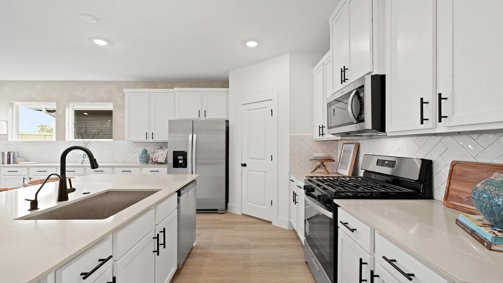 Kitchen with an island and vinyl floor
