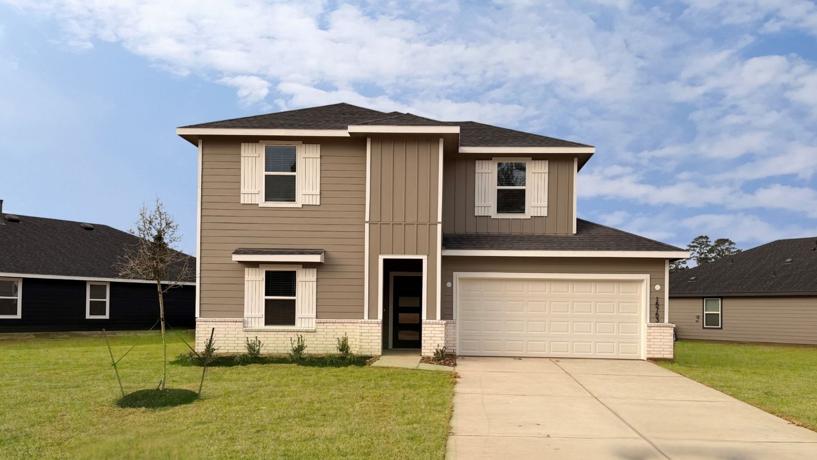two story house with 2 car garage