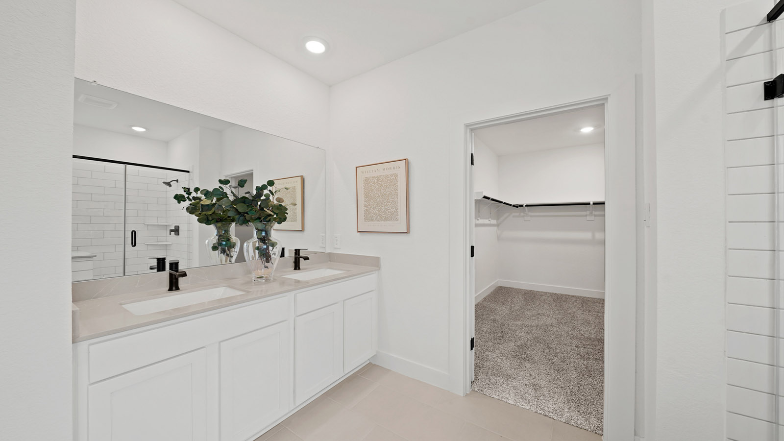 Primary bathroom with soaker tub and tile shower with semi frameless glass in Montgomery TX