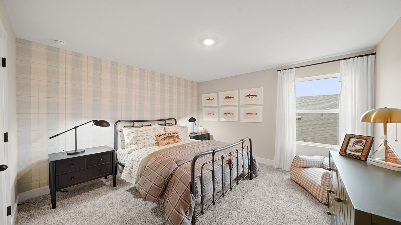 Second level secondary bedroom with carpet flooring and bright window